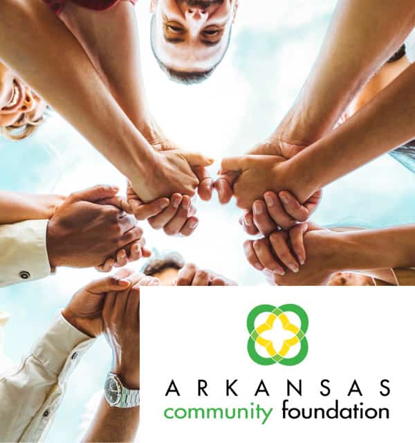 Group of people holding hands.